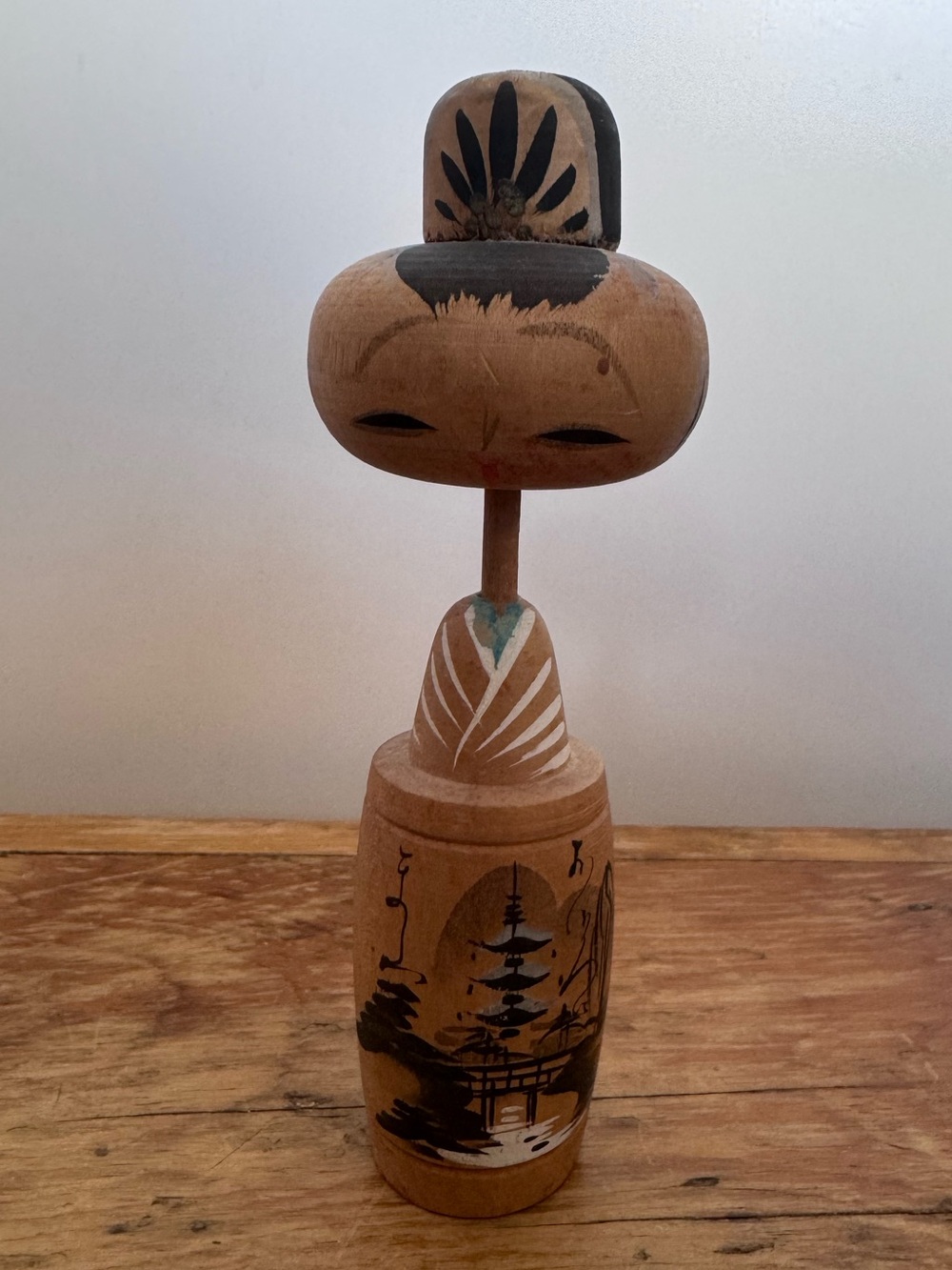 Vintage Wooden kokeshi doll with traditional Japanese design